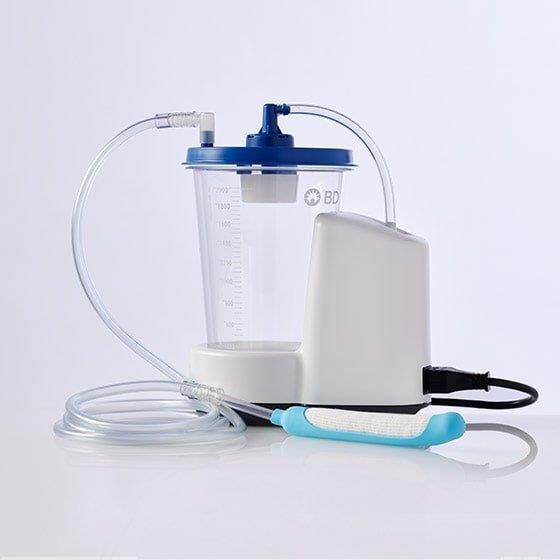 Side view of the PureWick&trade; Urine Collection System attached to the PureWick&trade; Female External Catheter with a power cord